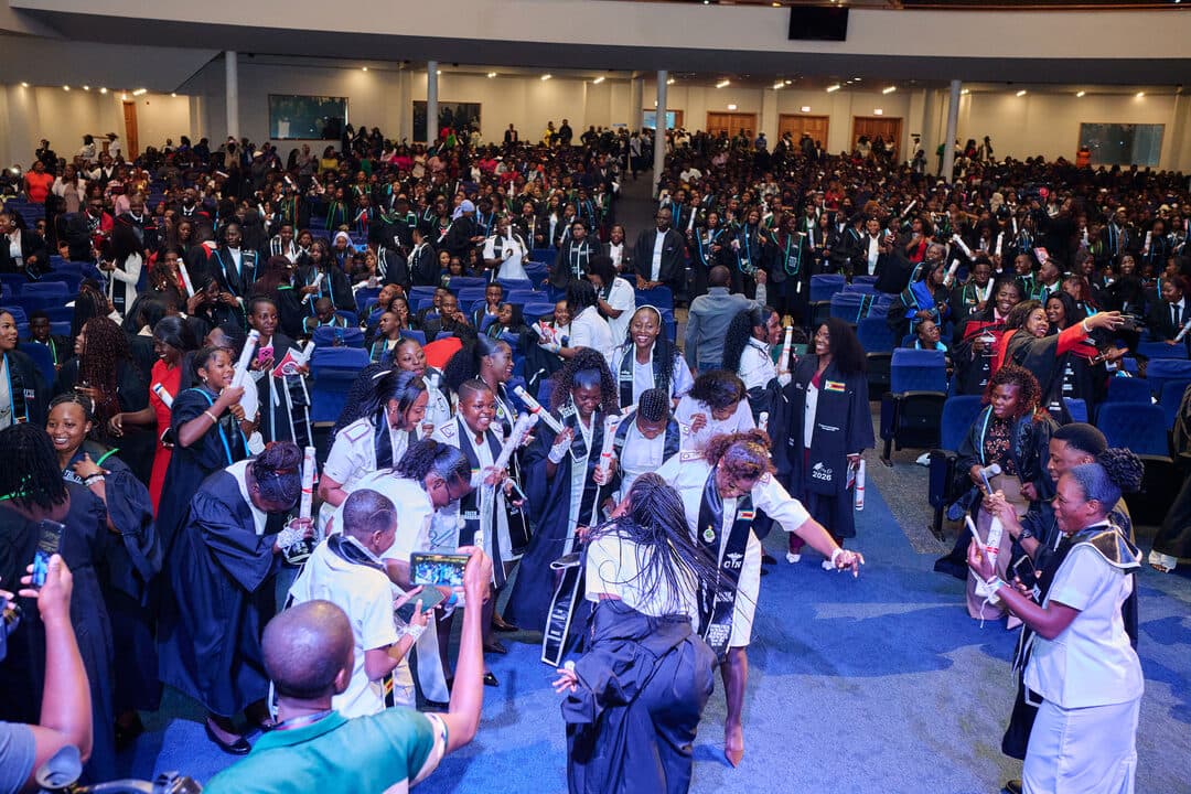 Graduates dancing in celebration